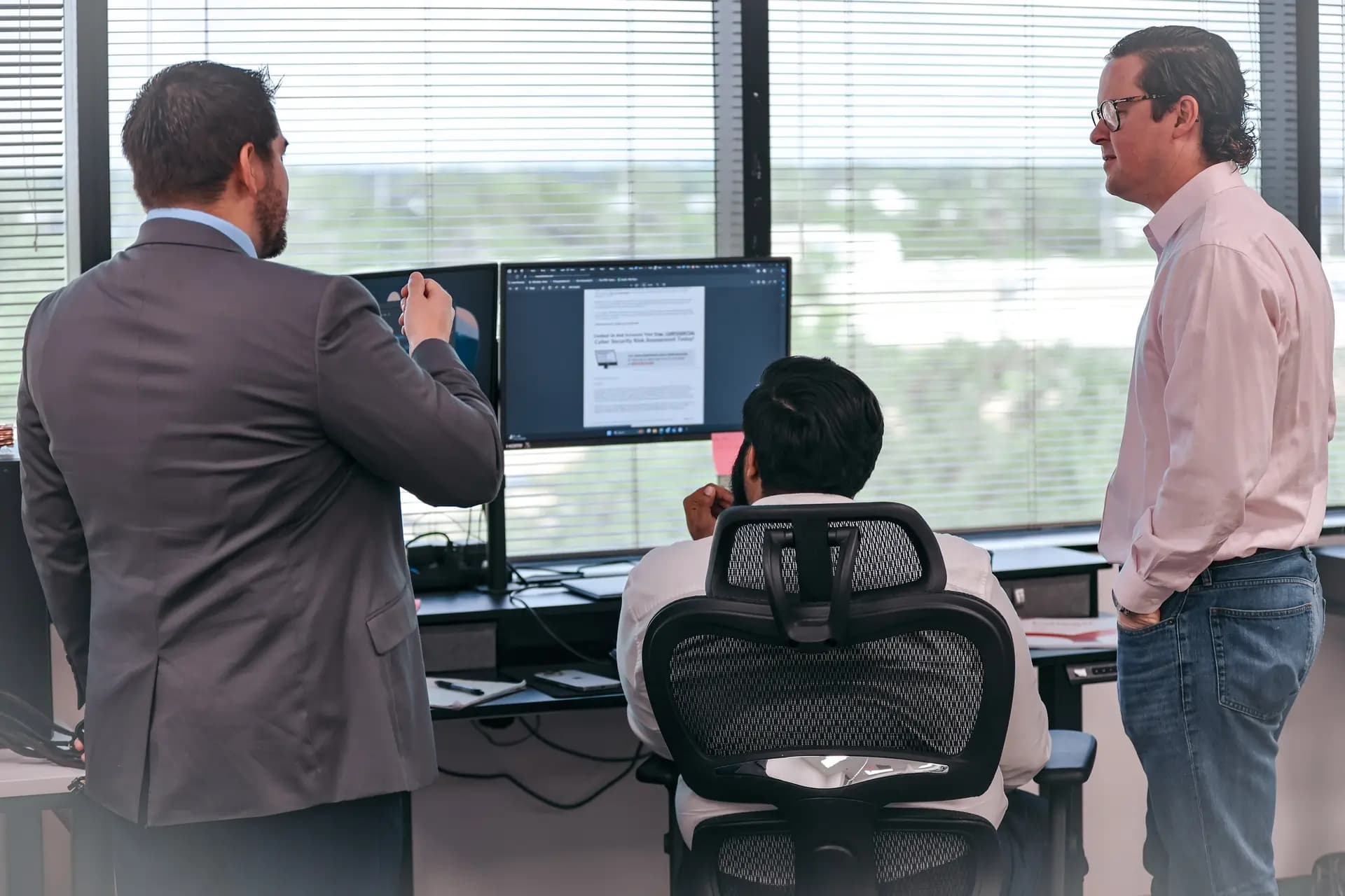 ITECS developers and engineers working on technical solutions