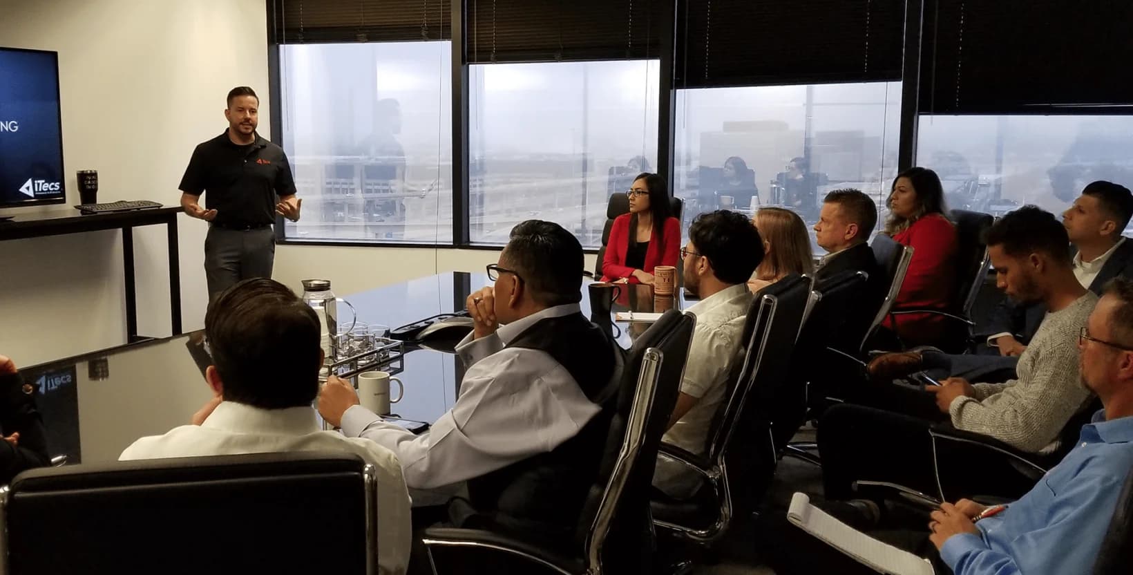 ITECS professionals in conference room strategic planning session