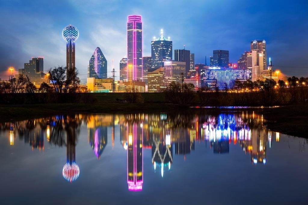 Dallas skyline Panoramic view of the Downtown Dallas skyline at twilight featuring the Reunion Tower and Bank of America Plaza, symbolizing the digital infrastructure connecting the North Texas business districts of Uptown, Plano Legacy West, and the Richardson Telecom Corridor.