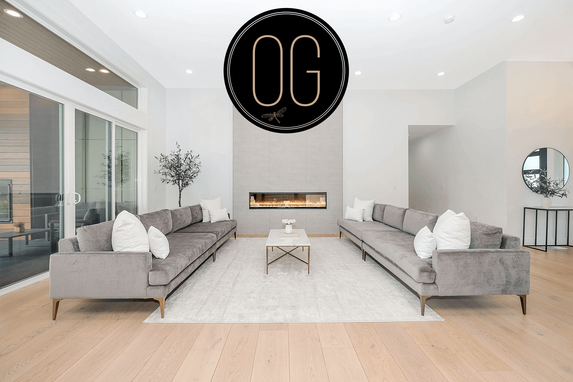 OG Interiors home-staging display with the company logo