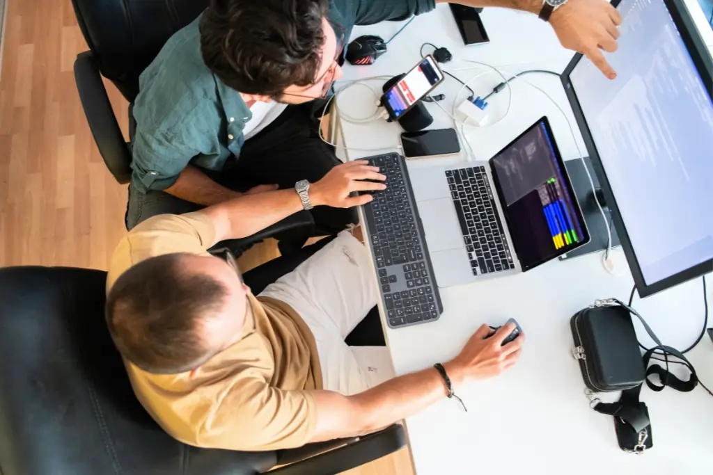 Top view of ITECS financial IT specialists working on secure banking solutions